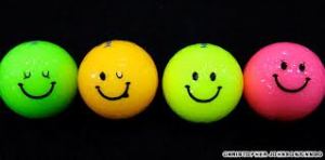 colored golf balls with smilies